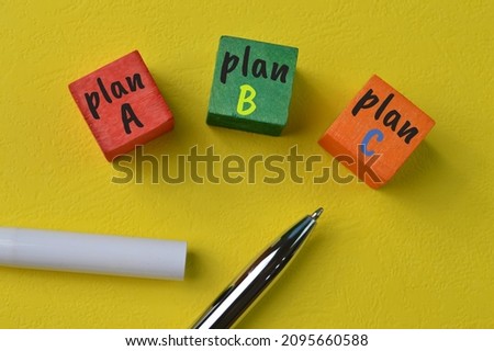 Plan A B C concepts of changes in business isolated on a yellow background.