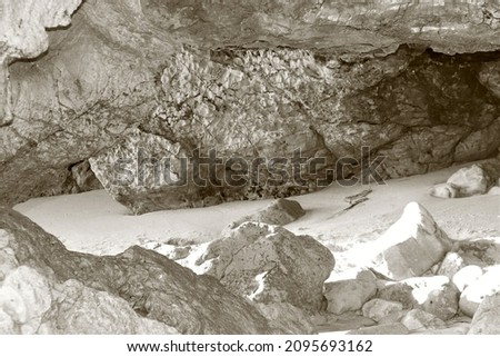 Beachside Cave with Rocks and Sand Black White Photography