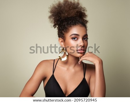 Beauty portrait of African American girl with afro hair. Beautiful black woman. Cosmetics, makeup and fashion Royalty-Free Stock Photo #2095720945