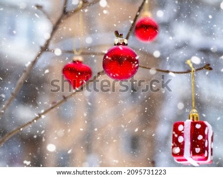 Red Toys on Tree Branches. New Year's Eve Concept.