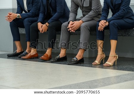 close-up Group of asian people sitting waiting for job interview.