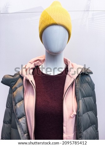 Part of a male mannequin warm dressed in casual,clothes on shop

