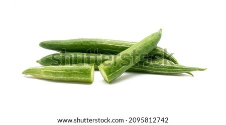 whole and slices Snake gourd isolated on white background.