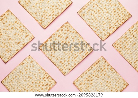 Jewish flatbread matza for Passover on color background