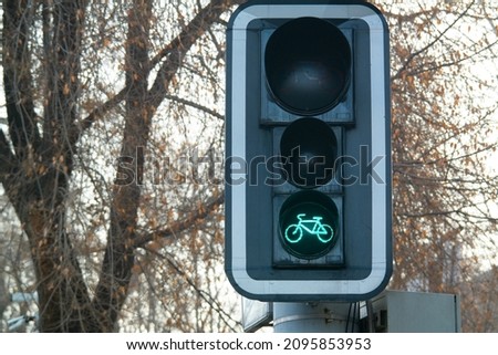 Green bike sign on a traffic light for bicycle close-up. Bikers go