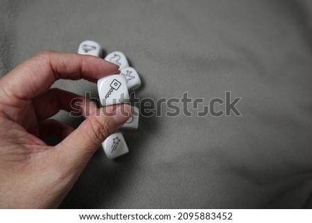 holding a dice of key design for target and important concept