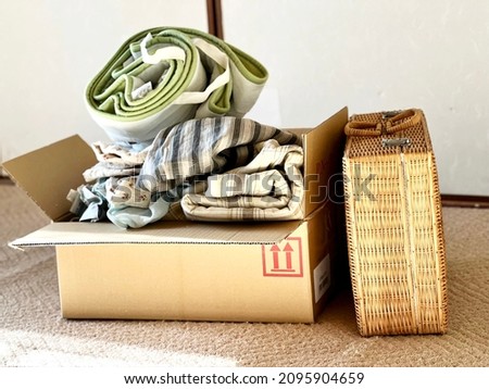 Clothes and baskets in cardboard boxes Royalty-Free Stock Photo #2095904659