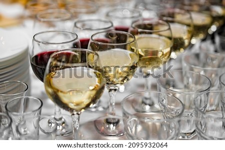 glasses with red and white wine standing on the table