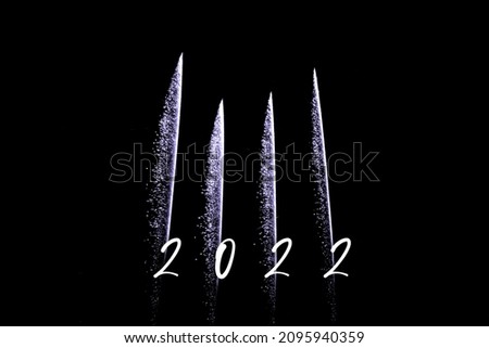 Happy new year 2022 purple fireworks rockets new years eve. Luxury firework event sky show turn of the year celebration. Holidays season party time. Premium entertainment nightlife background