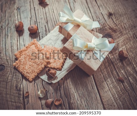 Gift boxes on old wooden background. Toned picture