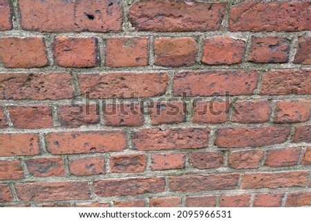 The texture of the wall of a building or structure made of brick, background, selective focus