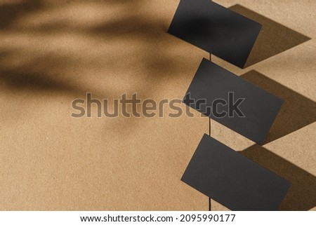 Black business cards on cork board table