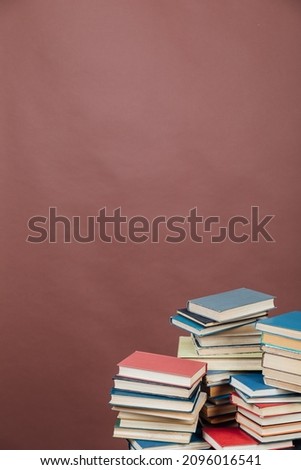 lots of books to study in the library on a brown background