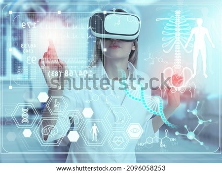 Medical technology concept. Doctor using virtual reality headset to study health data of patient Royalty-Free Stock Photo #2096058253