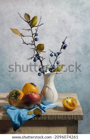 Wonderful still life with persimmons, vase and berries. Good illustration for book, journal or postcard.