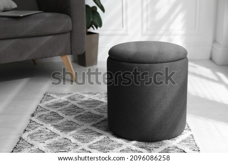 Stylish comfortable ottoman in room. Home design Royalty-Free Stock Photo #2096086258