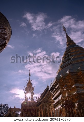 Golden pagoda at Wat Phra That Doi Suthep with blue sky background , Chiangmai, Thailand