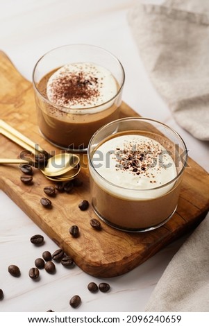 Italian chocolate and coffee mousse dessert semifreddo - half-frozen ice cream with whipped cream and cocoa powder in small glasses Royalty-Free Stock Photo #2096240659