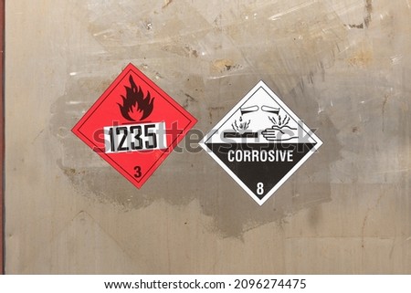 Dangerous goods labels for flammable liquids and corrosive substances