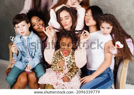 Lifestyle and people concept: young pretty diversity nations woman with different age children celebrating on birth day party together happy smiling, making selfie. African-american, asian and