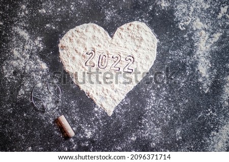 Heart Shape Created Wheat Flour with 2022 Writing, Creative Photo of Happy New Year 2022