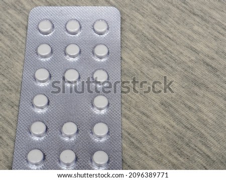 Silver blister packs pills isolated on white