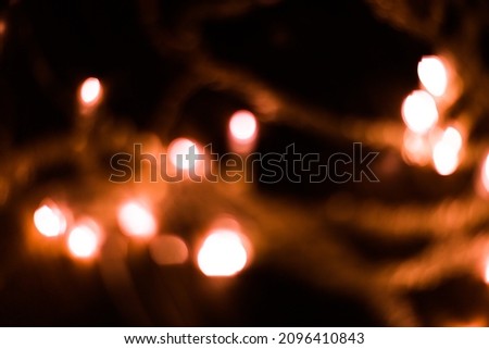 orange garland with flashlights, abstract light background