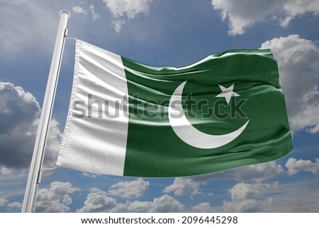 The flag of Pakistan on blue sky