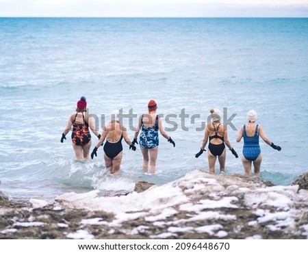 Group of elderly woman taking a winter swim in Lake Michigan Royalty-Free Stock Photo #2096448670