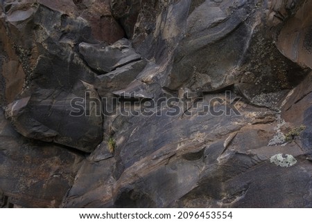 texture of mountain rock close up.  the photo shows the rocks that make up the rock.  the photo is suitable for a photo background and creating textures