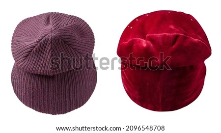 two women's crimson and red hats . knitted hat isolated on white background. 