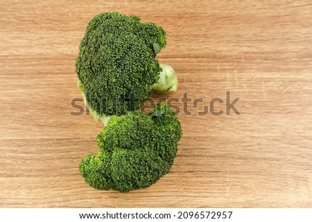Fresh broccoli isolated on wooden background. Copy space and selected focus image.