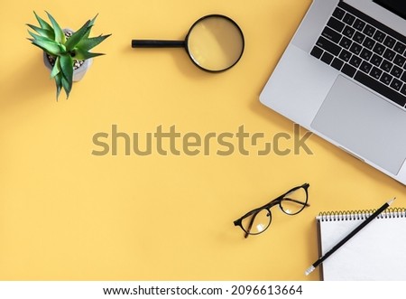 Flat lay, workplace, minimalism, yellow background, copy space.