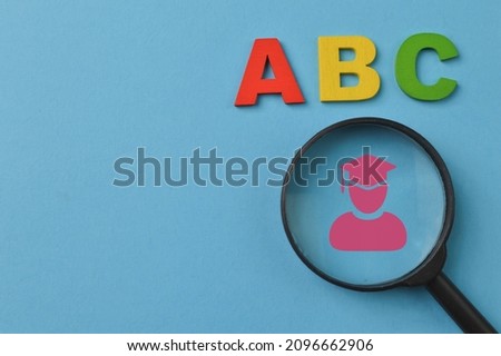 Wooden letters ABC and graduation symbol. Education concept