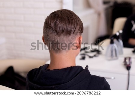 Male head with stylish haircut on barbershop background Royalty-Free Stock Photo #2096786212