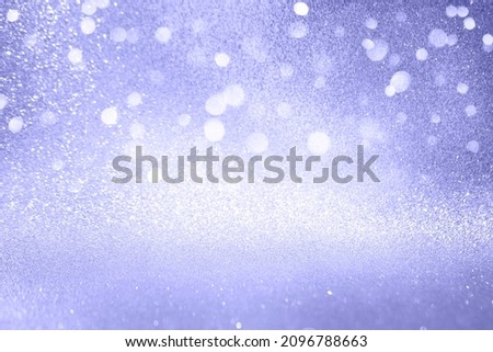 Abstract glitter background with soft bokeh