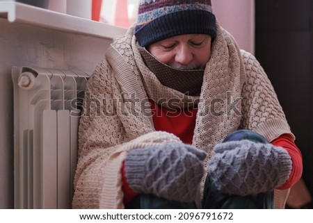 Man feeling cold at home with home heating trouble Royalty-Free Stock Photo #2096791672