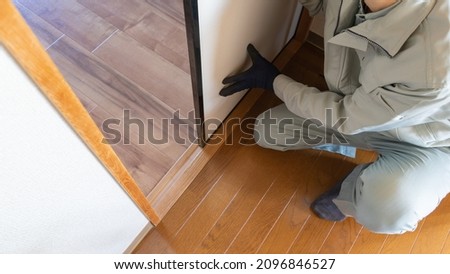Workers inspecting wooden door rails. "Japanese fusuma" Royalty-Free Stock Photo #2096846527