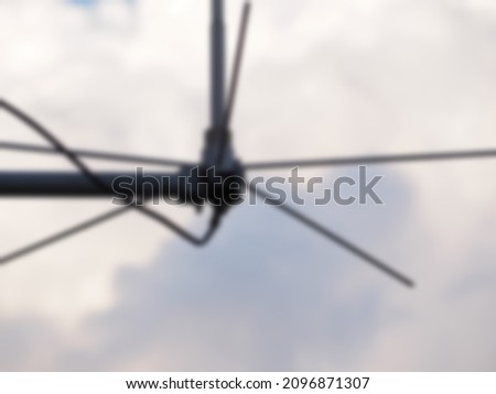 blurred gray tv towers used as background