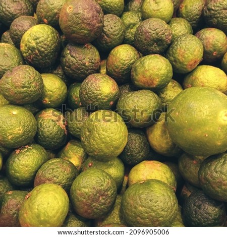 Natural Green Lime In The Market Close Up Macro Texture Background
