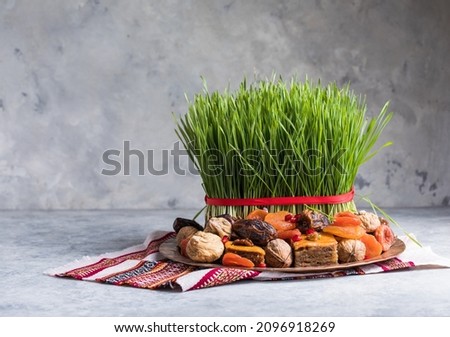 Novruz setting table decoration,  wheat grass, Azerbaijan national pastry pakhlava, new year sring celebration, nature awakening