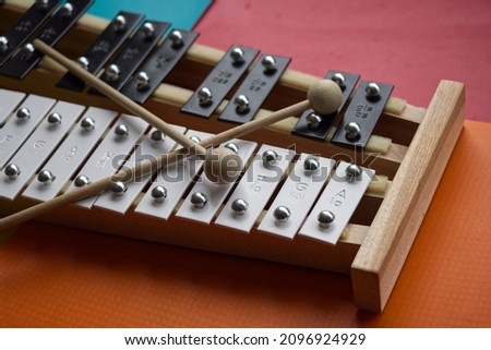 Black and white toy xylophone made of metal and wood (glockenspiel)	 Royalty-Free Stock Photo #2096924929