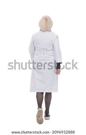full length. friendly woman doctor walking forward.