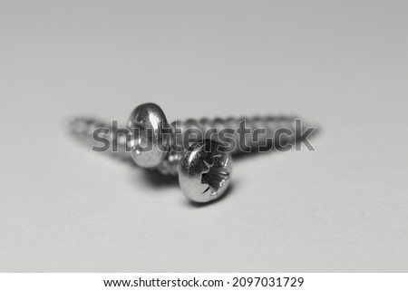 Stainless steel screw, white background, isolated