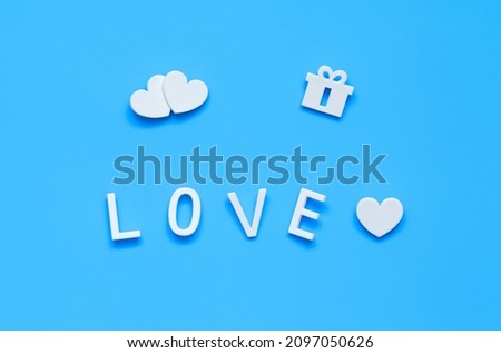 three hearts, love and gift. white on blue