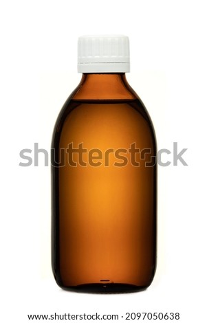 Brown colored transparent glass bottle with white cap, filled with liquid, no label, isolated on white background