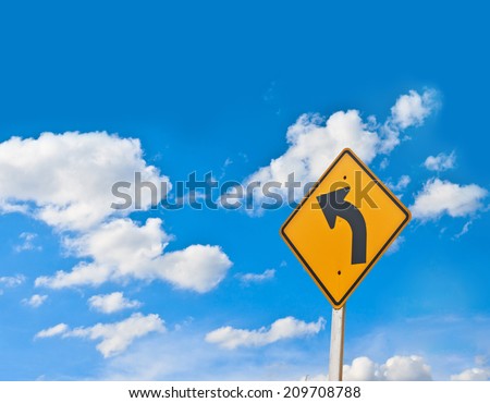 Direction sign- left turn warning on blue sky background