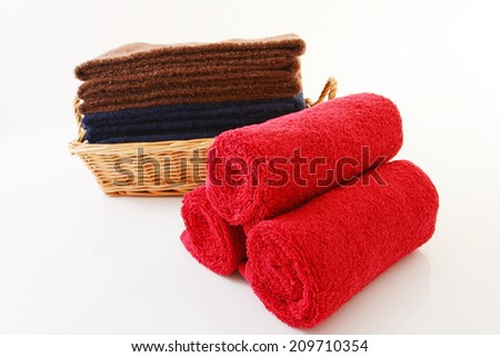 Soft and fluffy cotton towels on white