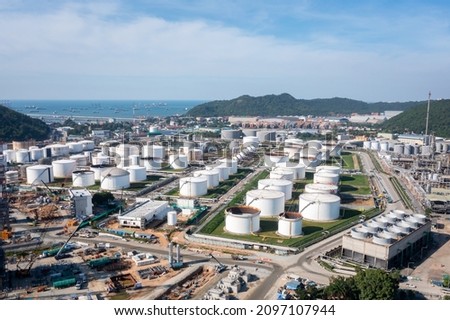 Oil refinery plant industry zone, Aerial view oil and gas petrochemical industrial, Refinery factory oil storage tank and pipeline steel photograph from drone of point view 