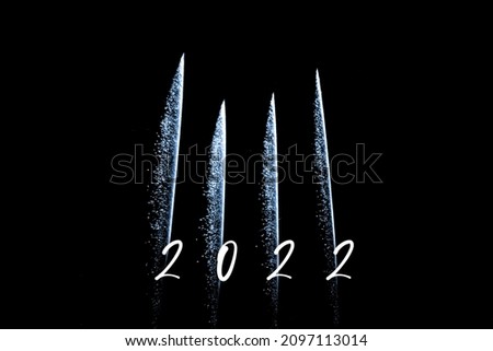 Happy new year 2022 blue fireworks rockets new years eve. Luxury firework event sky show turn of the year celebration. Holidays season party time. Premium entertainment nightlife background